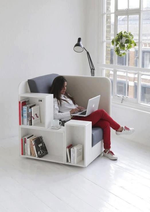 a super functional chair that includes a comfortable seat, a space divider to feel private, a couple of storage units, it's ideal as a mini home office