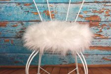a vintage chair with a white faux fur seat is a nice solution for a glam or shabby chic space