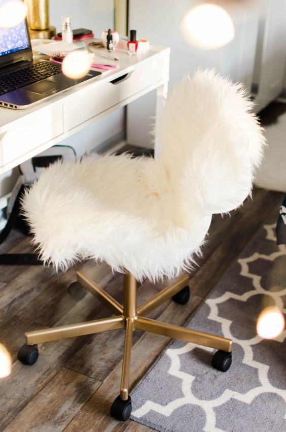 a white faux fur and gold chair with casters is a nice piece for a home office or a makeup space