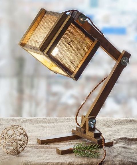 an industrial wood and burlap table lamp with a cubic lampshade is a cool and non-traditional solution