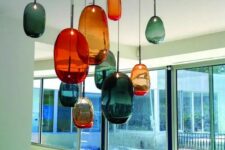 beautiful and mismatching glass bubble pendant lamps in orange and teal will make your kitchen colorful and unique