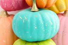 colorful pumpkins with gold splatters are a bold and fun solution for your fall decor