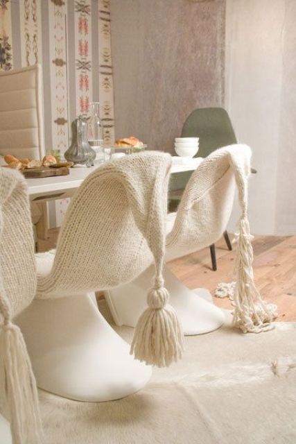 cover your usual dining chairs with white knit or crochet with large tassels to make them cute and very cozy for sitting