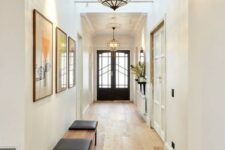 large mid-century modern framed glass pendant lamps bring so much light that two are enough for the whole hallway