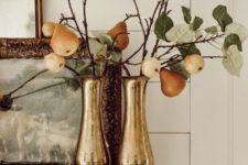 metallic vases with pear branches is a stylish fall decoration with a rustic feel
