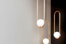 pendant lamps are inspried by pearls and by expectant mothers holding their bellies – these shapes are reflected in the spheric shapes