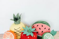 pumpkins painted as fruits and berries are a very funny and very playful decor idea for a fall space