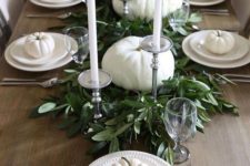 simple and elegant fall party styling with fresh greenery, white pumpkins and tall candles