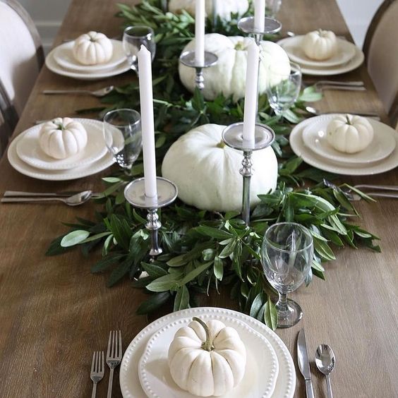 simple and elegant fall party styling with fresh greenery, white pumpkins and tall candles
