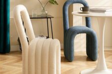 super cool modern chairs that are composed of bent upholstered pieces look fun, bold and will add interest to the space