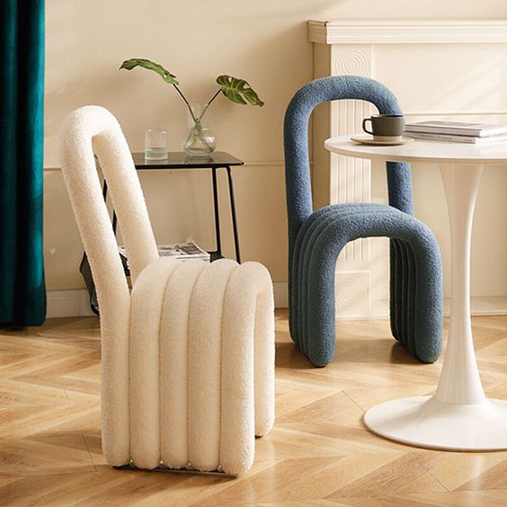 super cool modern chairs that are composed of bent upholstered pieces look fun, bold and will add interest to the space
