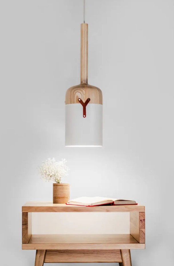 This pendant lamp has a cool bottle resembling design and is made of a unique blend of materials, which aren't characteristic for lamps