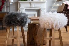 wooden stools with faux fur covers are very cozy and very welcoming during cold months