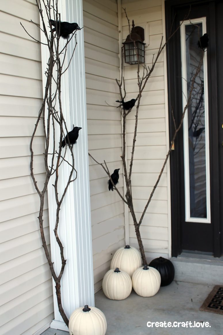 Several branches and raven's figures is more than enough to make a porch quite spooky.