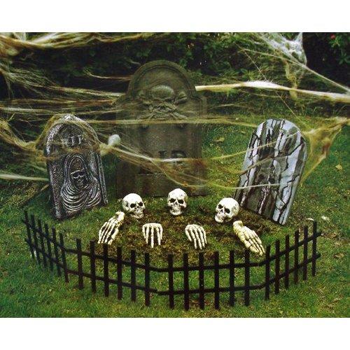 A small graveyard with skeleton parts is a great centerpiece for your yard's decor.