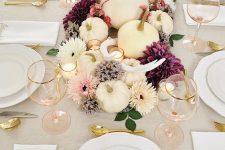 gold cutlery, gold rimmed glasses gold stemmed pumpkins for a modern refined Thanksgiving tablescape