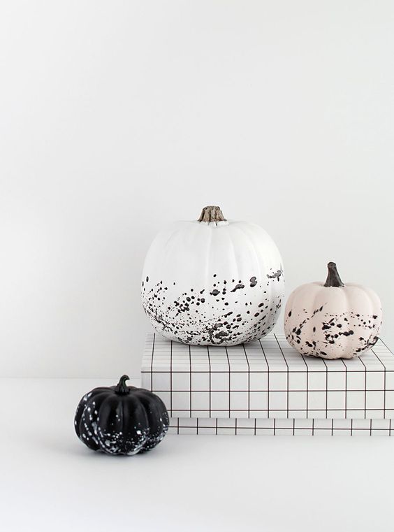 Gorgeous minimalist Halloween pumpkins   a white, black and blush one with splatters are awesome