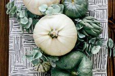 green and white pumpkins, greenery and artichokes for a lovely rustic Thanksgiving centerpiece