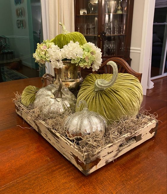 green velvet pumpkins and mercury glass ones in a wooden tray with hay for a lovely Thanksgiving centerpiece