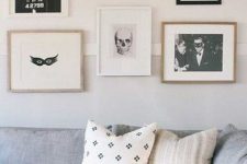 minimalist Halloween decor – a gallery wall of black and white scary pics that is amazing for non-tacky styling