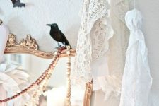 simple white ghosts of fabric and doilies are very easy to make and will give a slight vintage feel to your Halloween decor