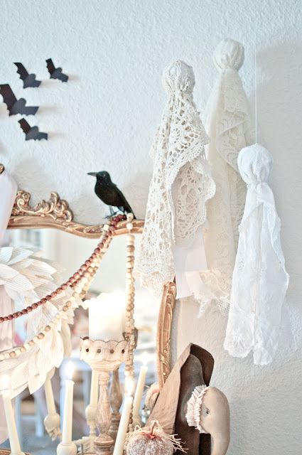 simple white ghosts of fabric and doilies are very easy to make and will give a slight vintage feel to your Halloween decor