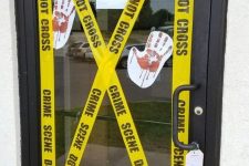 style your front door or some other doors like a crime scene – this is an easy and cool  decor idea for Halloween