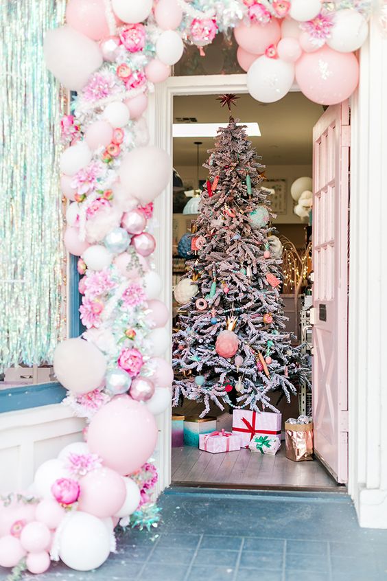 A fantastic pink balloon, pink peony, shiny garland and a Christmas tree with pastel ornaments and beads are amazing for a candy inspired Christmas celebration