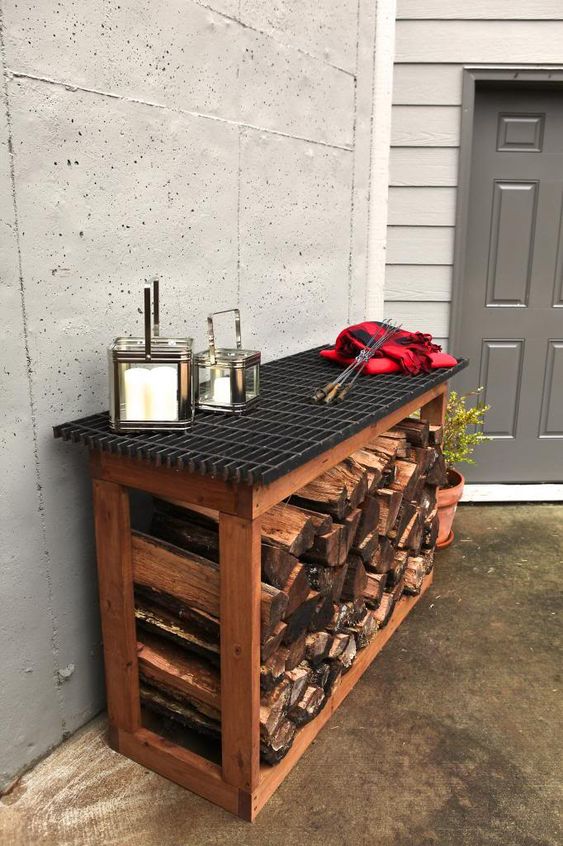 a simple console table with an open storage space that can be used for firewood is a nice idea for outdoors