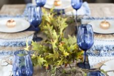 blue woven placemats with fringe and blue glasses will give a new and frehs look to your Thanksgiving table