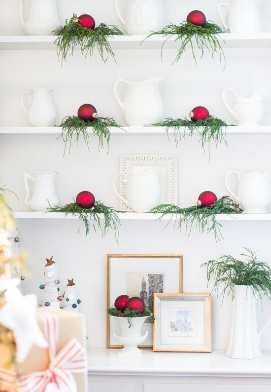 evergreens and red Christmas ornaments will bring a slight holiday feel to the space and make it Christmassy
