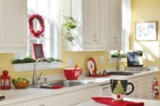 red cups, napkins, a berry wreath and evergreens for a light Christmas feel in the space
