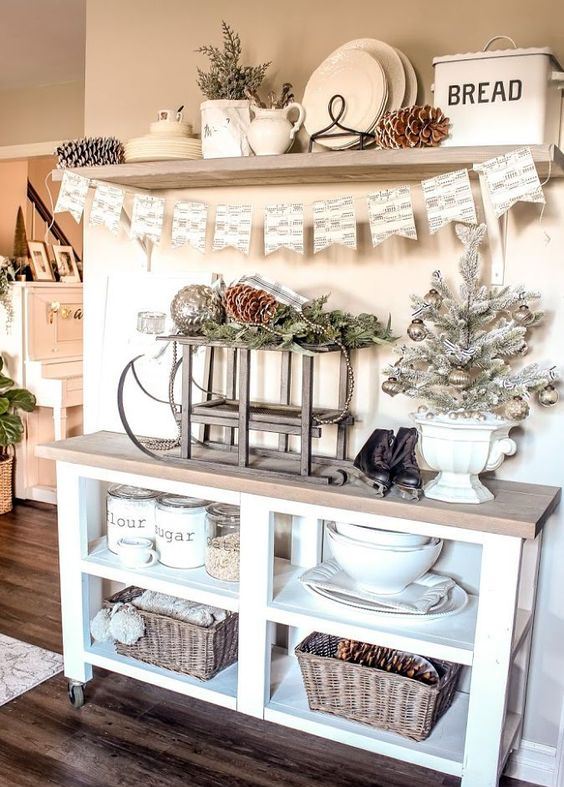 whitewashed evergreens, a frozen Christmas tree with metallic ornaments, pinecones and a cute bunting for a holiday look