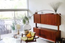 a fully closed mid-century modern storage unit features a couple of shelves – the tops of the storage compartments