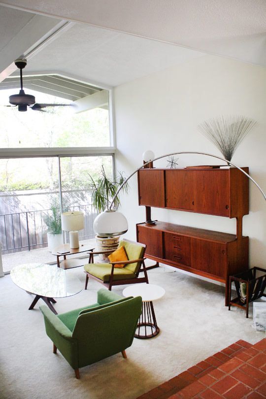 a fully closed mid-century modern storage unit features a couple of shelves - the tops of the storage compartments