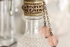 a gorgeous vintage perfume bottle with pendants is a chic and cool idea for any space