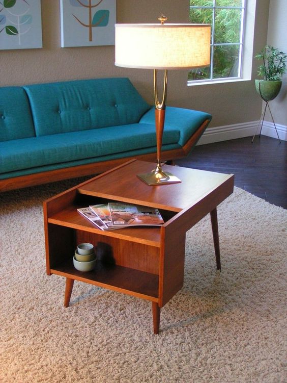 a lovely rich-stained mid-century modern coffee table with open storage compartments is a good idea for a nightstand, too