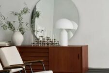 a large round mirror that makes a statement