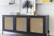 a navy sideboard with cane doors and gold knobs is a chic solution with a bold color combo that will make your space eye-catchy