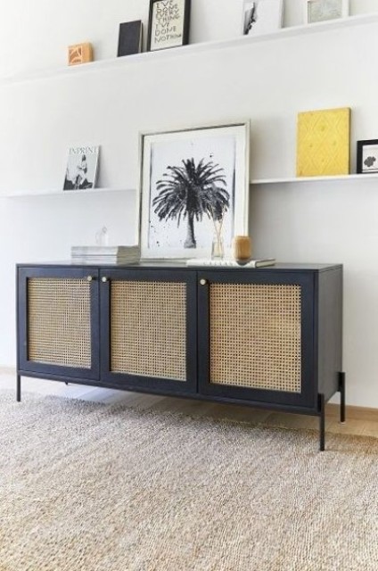 A navy sideboard with cane doors and gold knobs is a chic solution with a bold color combo that will make your space eye catchy