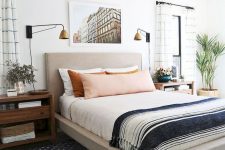 a neutral upholstered bed and rich stained nightstands will create a cozy base for a mid-century modern space