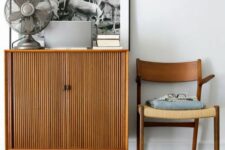 a stained fluted cabinet on cone legs will fit a mid-century modern, boho or even contemporary space