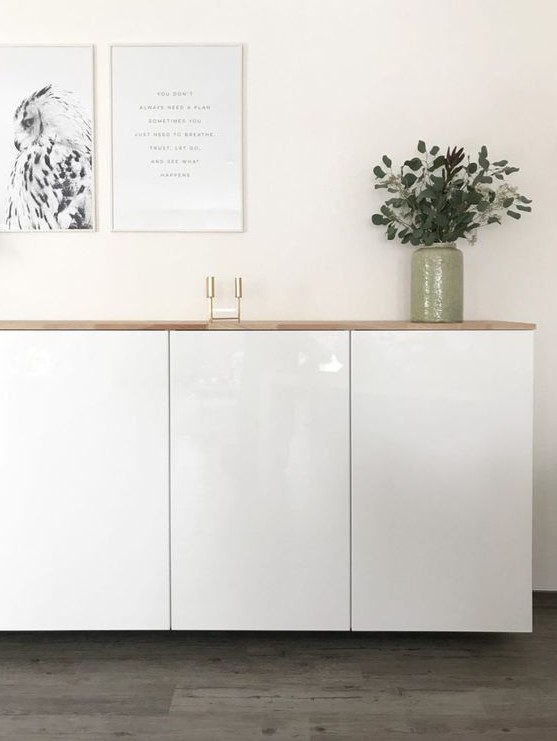 A stylish floating sideboard made of IKEA Metod cabients and a light colored wooden tabletop