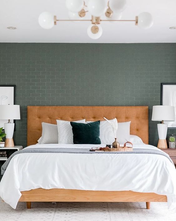 a stylish mid-century modern bed of wood and with a leather tufted headboard will make a warming statement in the space
