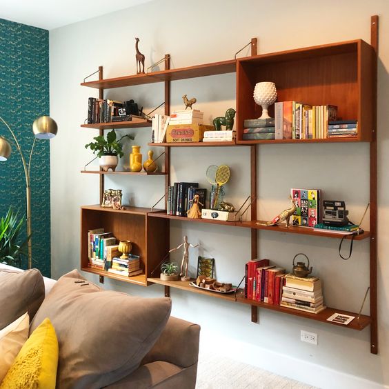 A wall mounted storage unit with open shelves and open box shelves features a lot of storage space