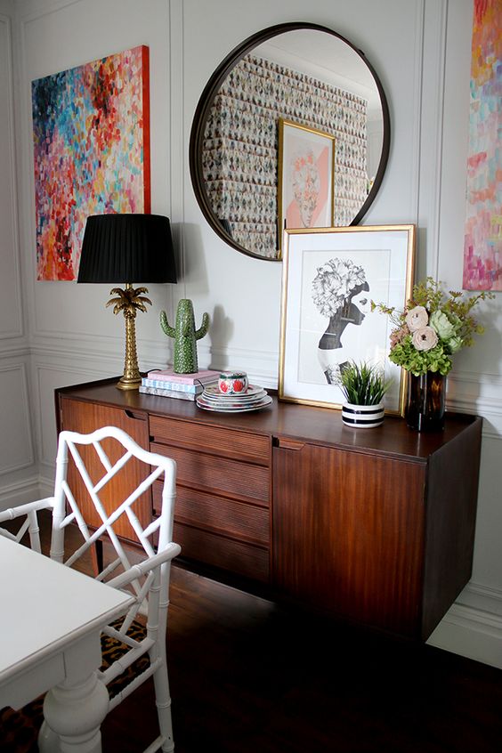 An elegant and chic dark stained credenza with drawers and usual compartments is a perfect addition to a dining room