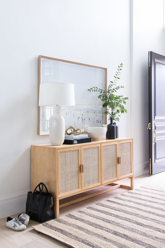 an elegant cane sideboard with cane doors is a lovely and stylish alternative to a usual console table in the entryway