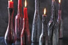 black bottles with red and deep purple wax from candles on them look scary and bloody, so you won’t have to decorate the holders too much