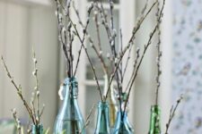 vintage blue and green bottles with willow will be a cool rustic decoration for spring