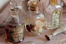 vintage bottles with lids, vintage cutlery and pink decor are a great combo for adding a vintage feel to the space